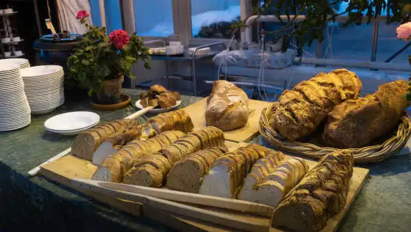 Very delicious-looking loafs of bread are lying on a table